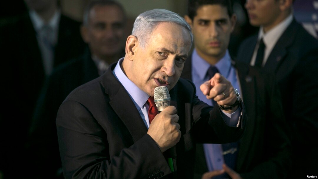 Israel's Prime Minister Benjamin Netanyahu gestures as he speaks to supporters of his Likud party as he campaigns in Netanya, north of Tel Aviv, March 11, 2015.