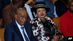 FILE - Lesotho's Prime Minister, Thomas Thabane and his wife, Maesaiah, are seated in court, in Maseru, Feb. 24, 2020.