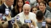 Pope Francis arrives for an audience with Vatican employees, in the Pope Paul VI hall, at the Vatican, Friday, Dec. 21, 2018. 