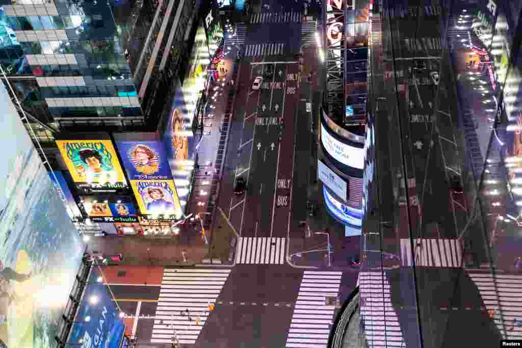 An empty Times Square is seen on the street following the outbreak of coronavirus, in New York City, March 18, 2020.