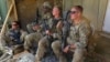 U.S. military advisers from the 1st Security Force Assistance Brigade sit at an Afghan National Army base in Maidan Wardak province, Afghanistan, Aug. 6, 2018.