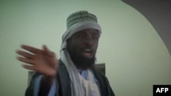 FILE - Photo made from Boko Haram video released by the Nigerian Islamist extremist group Boko Haram and obtained by AFP shows the leader of the Nigerian Islamist extremist group Boko Haram, Abubakar Shekau preaching to locals in an unidentified town. 