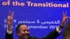 Sudanese Prime Minister Abdalla Hamdok flashes the victory gesture during a press conference unveiling the first cabinet since veteran leader Omar al-Bashir's overthrow, in Khartoum, Sept. 5, 2019. 