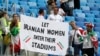 People supporting Iranian women are hold a banner at the stands during the group B match between Morocco and Iran at the 2018 soccer World Cup in the St. Petersburg Stadium in St. Petersburg, Russia, June 15, 2018. 