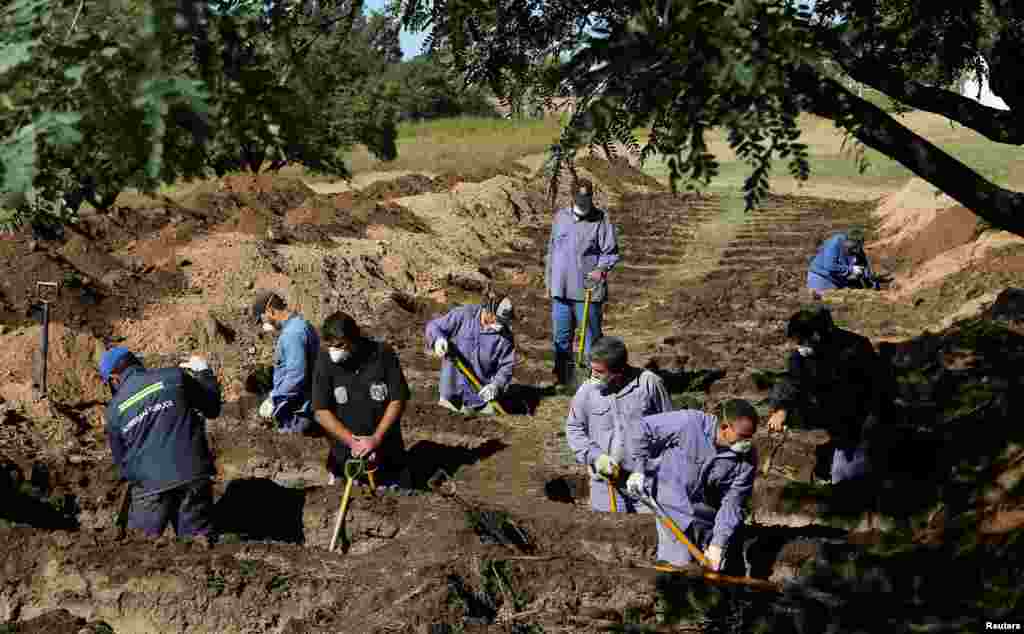 Gravediggers prepare new graves at the San Vicente cemetery, during the coronavirus disease (COVID-19) spread, in Cordoba, Argentina.