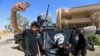 Members of the Iraqi Army are photographed with an Islamic State flag, claimed after fighting with Islamic State militants in western Mosul, Iraq, June 26, 2017.