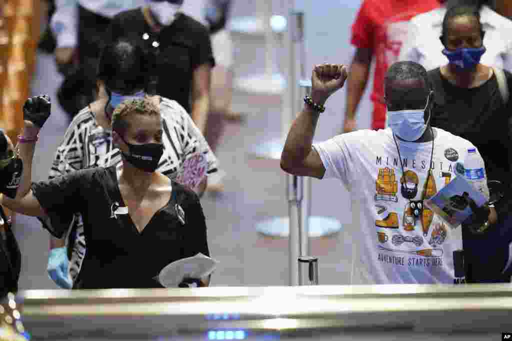 Mourners pass by the casket of George Floyd during a public visitation at the Fountain of Praise church in Houston, Texas. Floyd died on May 25, 2020 while he was in Minneapolis police custody.