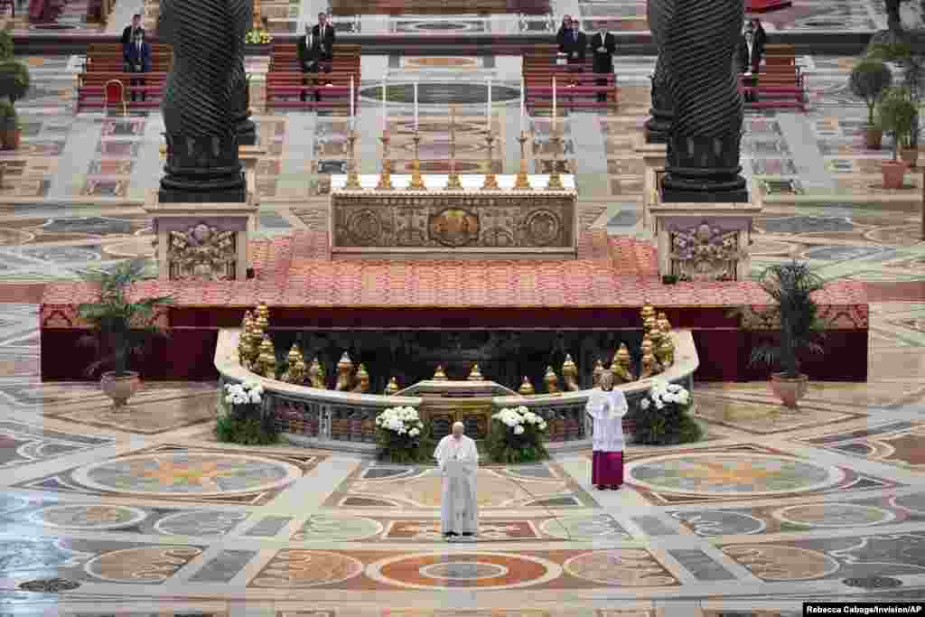 Pope Francis reads his "Urbi et Orbi" ("To the City and the World") message in St. Peter's Basilica with no public participation due to an outbreak of the coronavirus disease (COVID-19) on Easter Sunday at the Vatican.
