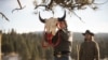 Mo (actor Mo Brings Plenty) raises a bison skull in a vision quest ceremony for Kayce Dutton (Luke Grimes) in Season 4, Episode 9 of Paramount+ "Yellowstone."