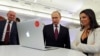 Russian President Vladimir Putin and Editor-in-chief of RT, 24-hour English-language TV news channel, Margarita Simonyan, attend an exhibition marking RT's 10th anniversary in Moscow, Russia, Thursday, Dec. 10, 2015. (Mikhail Klimentyev/Sputnik, Kremlin Pool Photo via AP)