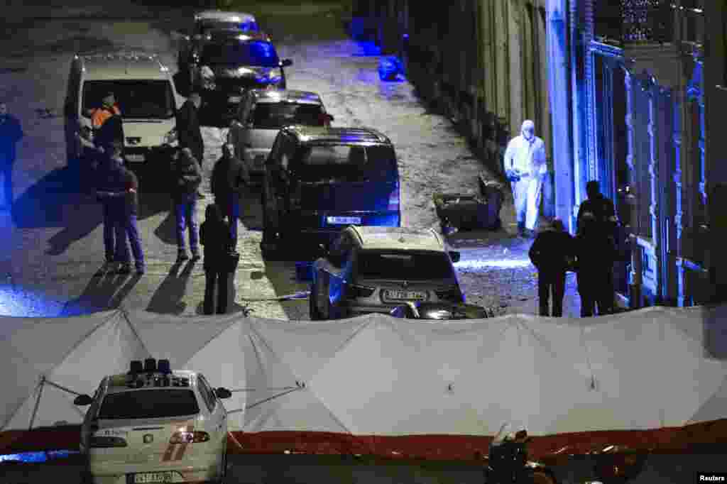 Belgian police inspect an apartment in central Verviers, a town near the German border, in east Belgium, Jan. 15, 2015.