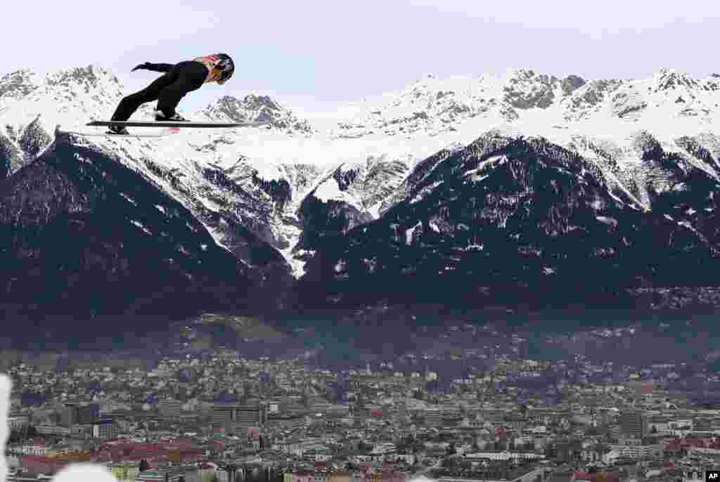 Ryoyu Kobayashi of Japan soars through the air during the trial round of the third stage of the 68th four hills ski jumping tournament in Innsbruck, Austria.