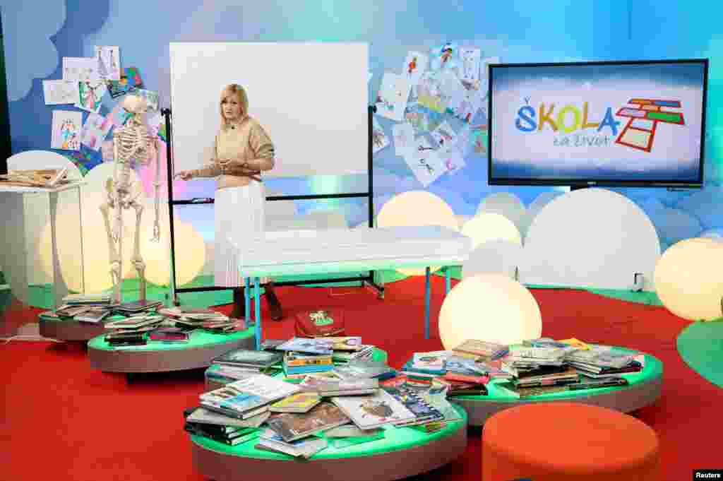 A teacher gives a lecture during the "School on Third" program in Croatian National Televisin (HRT) headquarters in Zagreb. Due to the coronavirus outbreak all schools in Croatia are closed, children can attend school at home on Croatian National Televison and online.
