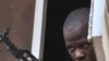 A Malian soldier looks on as junta leader captain Amadou Sanogo speaks at the Kati military camp near Bamako, April 3, 2012.