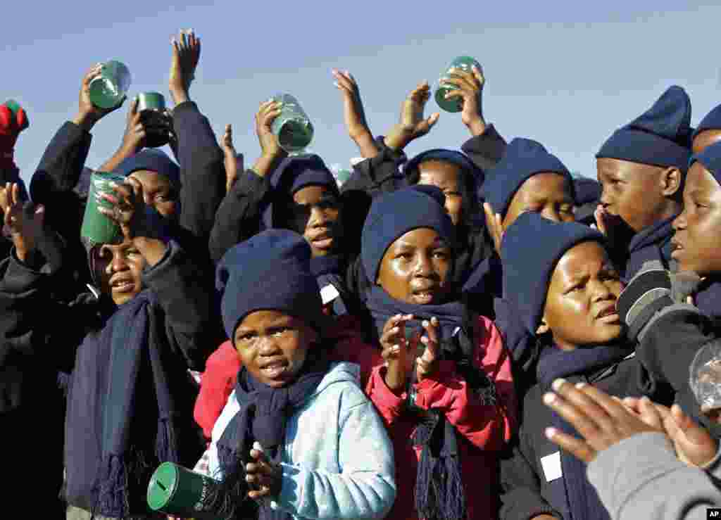 Children sing happy birthday in honor of former South African president Nelson Mandela during celebrations for Mandela's birthday in Mvezo, South Africa, July 18, 2012.