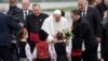 Pope Francis is welcomed by children wearing traditional dresses upon his arrival in Sofia, Bulgaria, May 5, 2019. Pope Francis is visiting Bulgaria, the European Union's poorest country and one that taken a hard line against migrants, a stance that confl