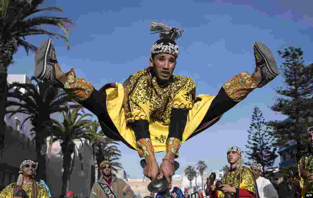 A Gnawa traditional group performs in the city of Essaouira, Dec. 14, 2019, to celebrate the decision of adding the Gnawa culture to UNESCO's list of Intangible Cultural Heritage of Humanity.