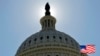 FILE - The U.S. flag flies next to the Capitol building in Washington, D.C. On Wednesday, the Senate blocked bills pertaining to undocumented aliens who commit crimes in the United States.