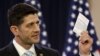 US Speaker of the House Paul Ryan (R-WI) displays a copy of the US Constitution while delivering a speech on "the state of American politics" to interns on Capitol Hill in Washington, March 23, 2016. 