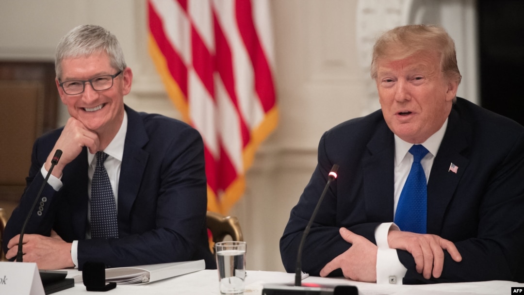 FILE - U.S. President Donald Trump speaks alongside Apple CEO Tim Cook in the State Dining Room of the White House in Washington, March 6, 2019. 