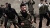 FILE - Syrian rebels attend a training session in Maaret Ikhwan near Idlib, Syria. 