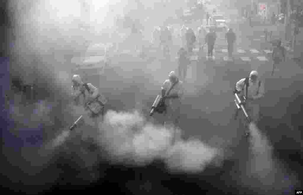 Iranian firefighters disinfect streets in the capital Tehran in a bid to halt the wild spread of coronavirus.