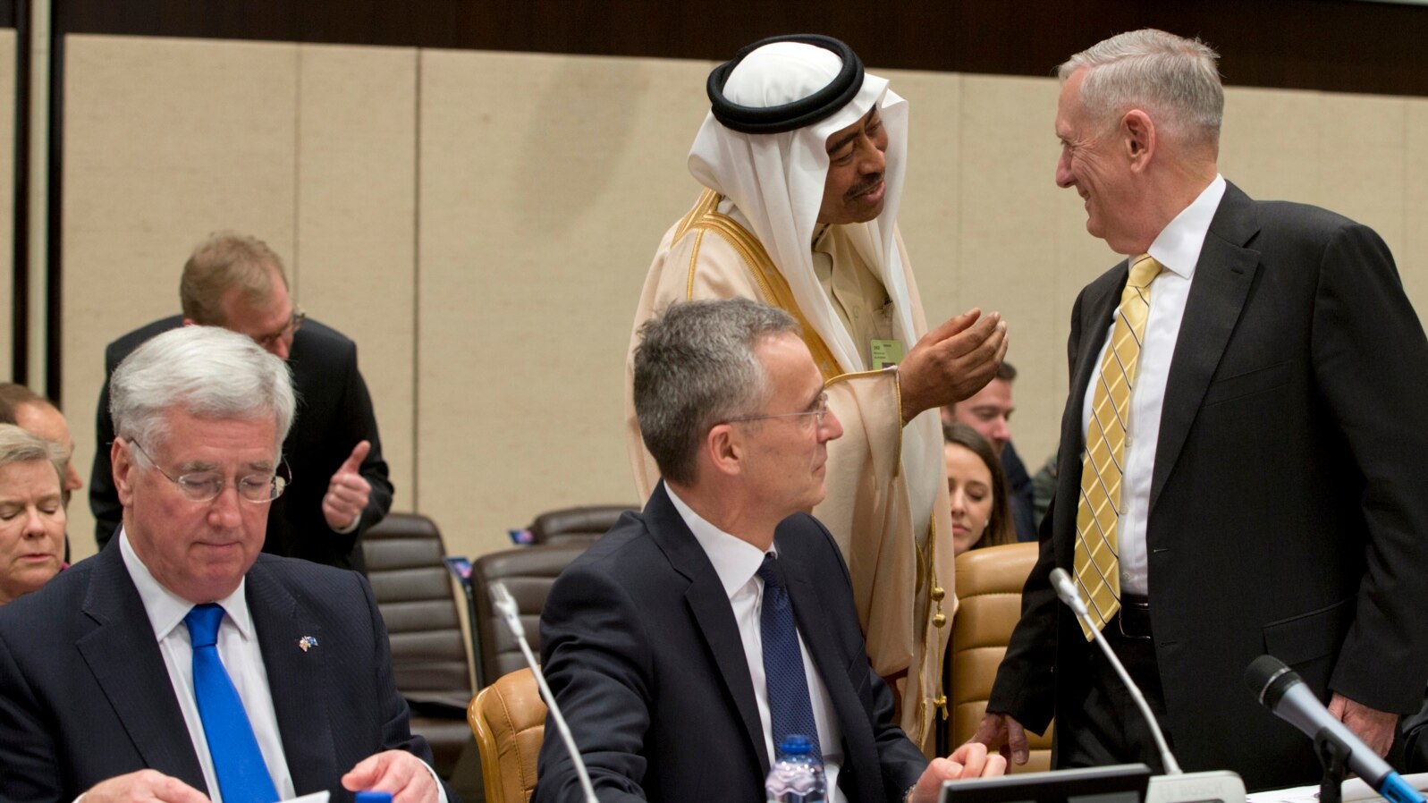FILE - Saudi Arabia's Deputy Defense Minister Mohammed Alayeesh, second right, speaks with U.S. Secretary of Defense Jim Mattis, right, during a meeting of the counter-Islamic State Coalition at NATO headquarters in Brussels, Feb. 16, 2017.