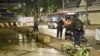 Central Investigation Bureau members stand near the spot where a former Cambodian MP was reportedly shot dead by a man on a motorbike in Bangkok, Thailand, Jan. 7, 2025. 