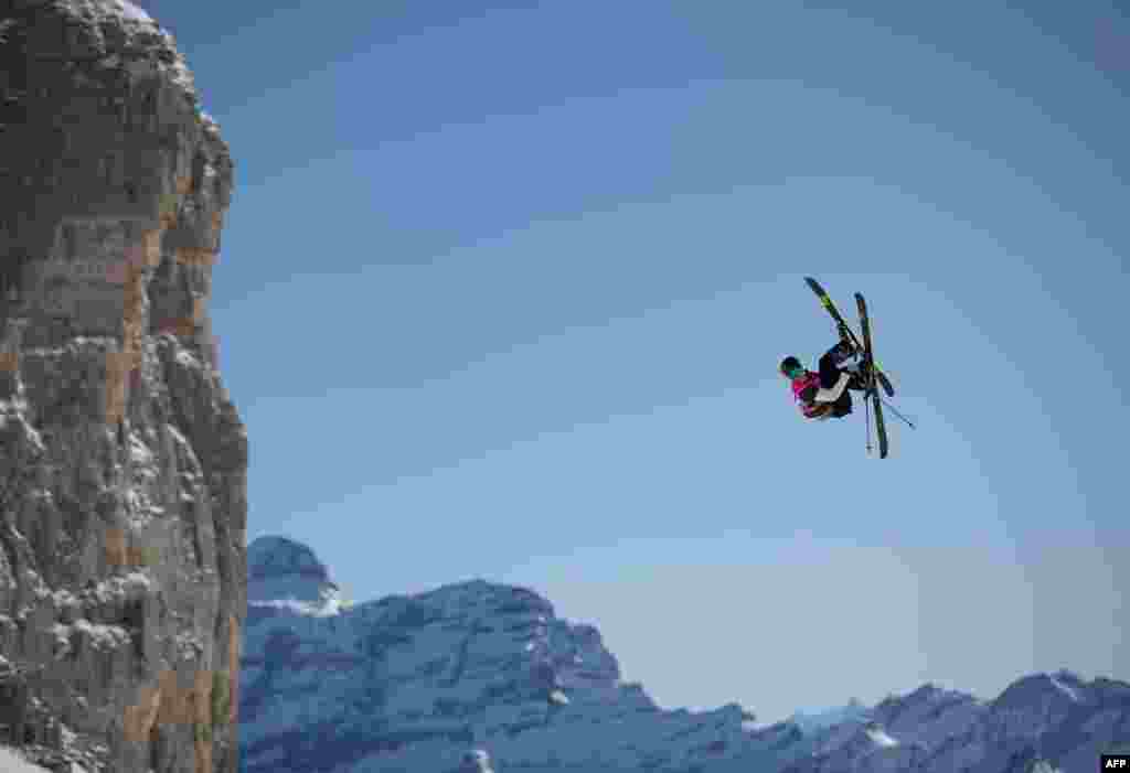 This handout photo released by the Olympic Information Services (OIS) of the International Olympic Committee (IOC) shows Switzerland's Nils Rhyner competing in the Freestyle Skiing Men’s Freeski Slopestyle at Leysin Park near Lausanne in Switzerland.