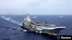 2018年4月18日，中國航母遼寧號參加中國海軍在西太平洋的軍事演習。