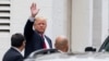 Republican presidential candidate Donald Trump waves as he arrives for a meeting with House Speaker Paul Ryan of Wis., at the Republican National Committee Headquarters on Capitol Hill in Washington, May 12, 2016. 