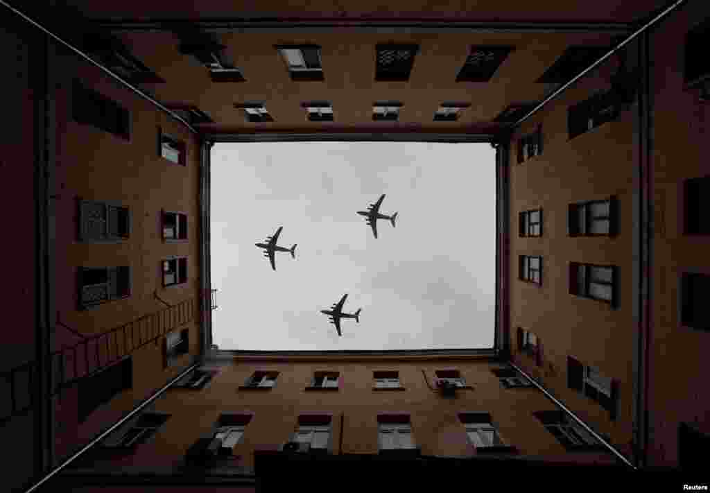 Russian Il-76 military transport aircrafts fly in Moscow during a rehearsal for the 75th anniversary of the victory over Nazi Germany in World War II.