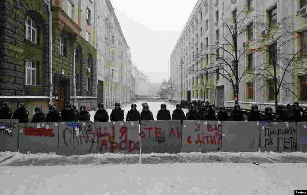 Interior Ministry personnel block a street in central Kyiv, Dec. 12, 2013.