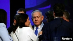 FILE - Israeli Prime Minister Benjamin Netanyahu looks on after speaking to supporters at his Likud party headquarters following the announcement of exit polls during Israel's parliamentary election in Tel Aviv, Sept. 18, 2019.