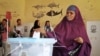 A woman casts her vote in the presidential election in Hargeisa, in the semi-autonomous region of Somaliland, in Somalia, Nov. 13, 2017. 