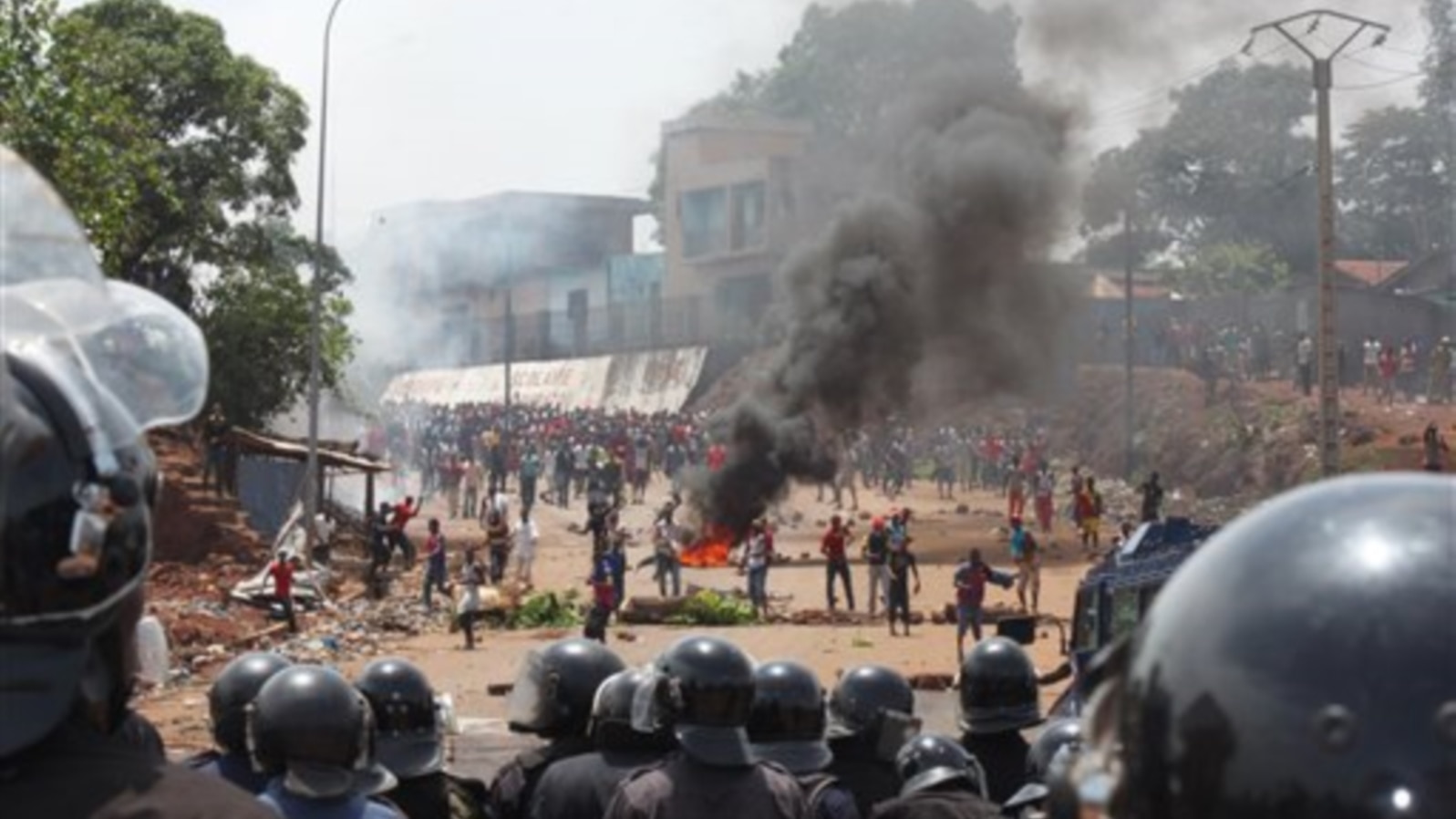 FILE - Opposition protestors clash with police in Conakry, Guinea, May 2013.