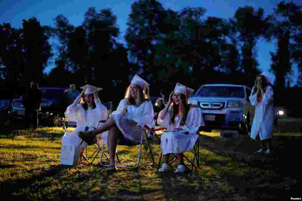Seniors watch a video retrospective of their time in high school during Pioneer Valley Regional School’s graduation, which was held in the Northfield Drive-In Theater because of the coronavirus disease (COVID-19) outbreak, in Hinsdale, New Hampshire, June 8, 2020.