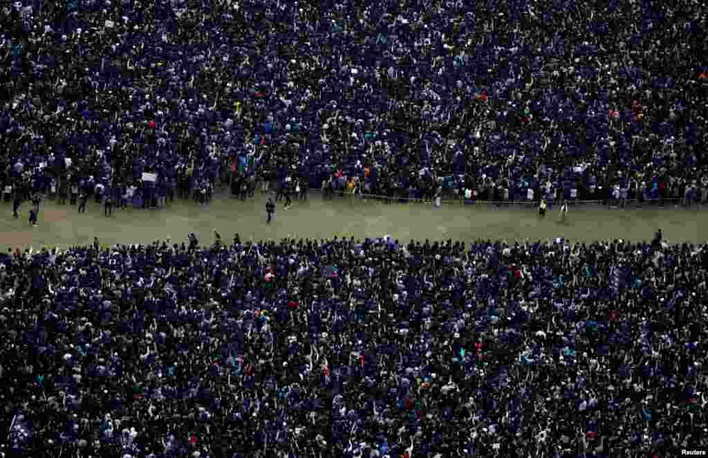 Anti-government protesters attend a demonstration on New Year's Day to call for better governance and democratic reforms in Hong Kong, China.