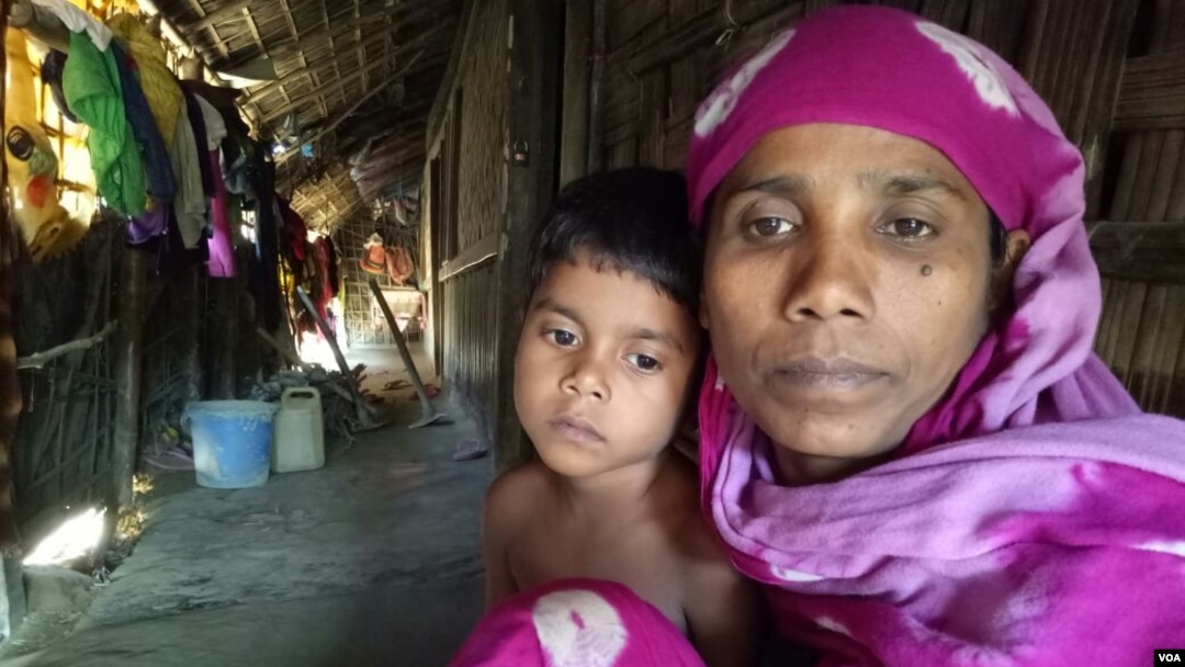 FILE - Rohingya refugee woman Noor Ayesha and her 5-year-old daughter at a Rohingya colony in Cox's Bazar, Bangladesh. 