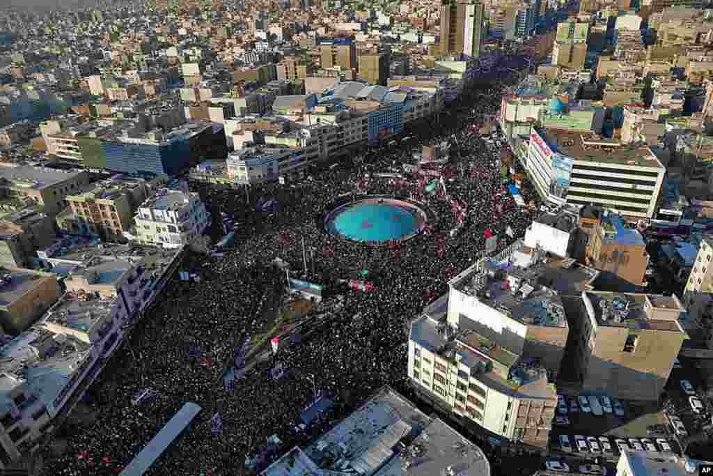 In this aerial photo released by an official website of the office of the Iranian supreme leader, mourners attend a funeral ceremony in Tehran for Gen. Qassem Soleimani and his comrades, who were killed in Iraq in a U.S. drone strike.