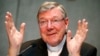 FILE - Cardinal George Pell talks during a news conference at the Vatican July 9, 2014.