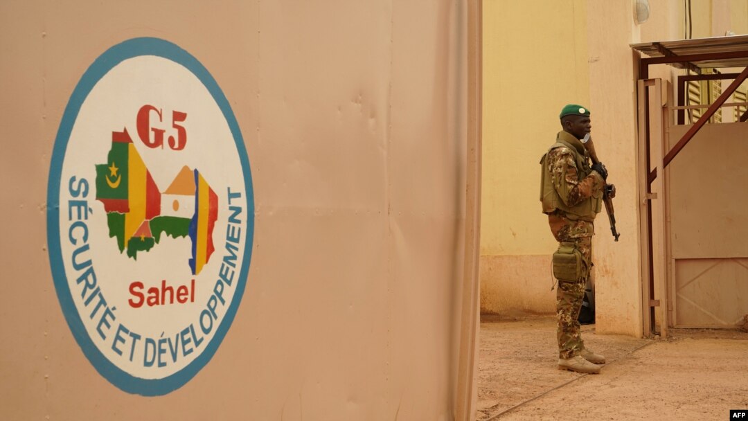 FILE - A Malian Army soldier with the G5 Sahel, an institutional framework for coordination of regional cooperation in development policies and security matters in West Africa, is seen in Sevare, May 30, 2018.