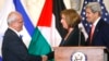 Chief Palestinian negotiator Saeb Erekat (L) shakes hands with Israel's Justice Minister Tzipi Livni near U.S. Secretary of State John Kerry after announcing further talks at a news conference in Washington July 30, 2013.