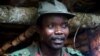 FILE - Joseph Kony, leader of the Lord's Resistance Army, meets with delegation of 160 officials, lawmakers from northern Uganda, in Congo near the Sudan border, July 31, 2006.