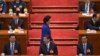 Newly-named Chinese vice Premier Liu Yandong walks past top leaders, including (front row from left to right), National People's Congress chairman Zhang Dejiang and Chinese President Xi Jinping, in Beijing's Great Hall of the People, China, March 16, 2013