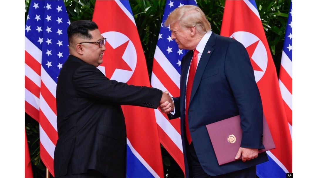 FILE - North Korea leader Kim Jong Un and U.S. President Donald Trump shake hands at the conclusion of their meetings at the Capella resort on Sentosa Island Tuesday, June 12, 2018 in Singapore.