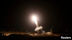 FILE - An interceptor rocket is launched from an "Iron Dome" defense system in the southern Israeli city of Ashdod, July 11, 2014. The MOU signed in Washington Wednesday locks in an additional $500 million annually for Israeli missile defense.