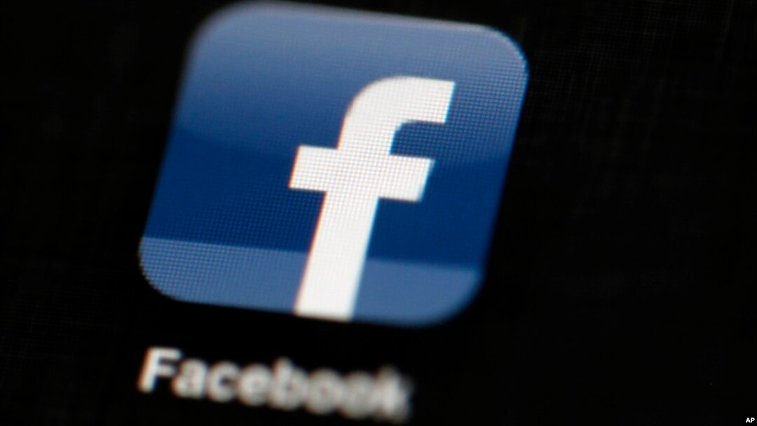 FILE - In this May 16, 2012, file photo, the Facebook logo is displayed on an iPad in Philadelphia. Facebook is under fire for failing to rein in fake and biased news stories that some believe may have swayed the presidential election. Its predicament ste
