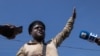 FILE - Former police officer Jimmy "Barbecue" Cherizier, leader of the 'G9' coalition, speaks during a press tour of the La Saline shanty area of Port-au-Prince, Haiti, Nov. 3, 2021.