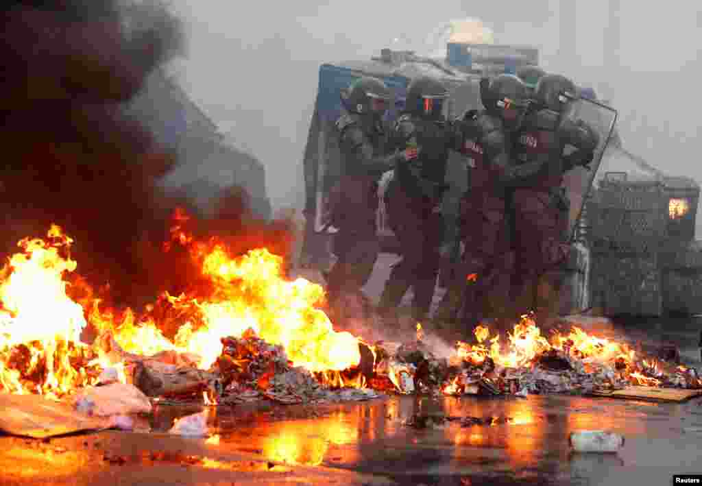 Members of the security forces are seen during a protest against Chile's government in Valparaiso, Chile, Feb. 18, 2020.